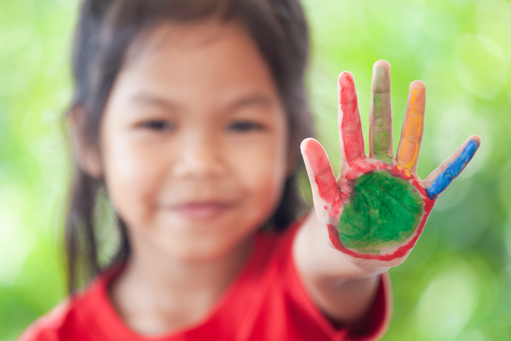 Asian girl doing a painting activity