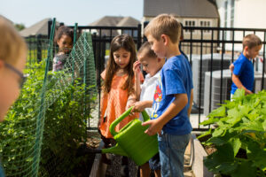 kids watering plants childcare opportunities 1
